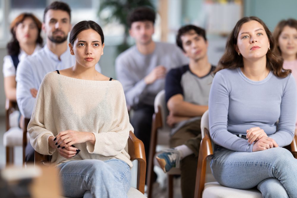 Youth attend offline lesson, study, and listen to seminar, students listen to teacher. Language conversation speaking club, team building, professional development courses, educational seminar.